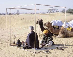 men drinking tea in desert